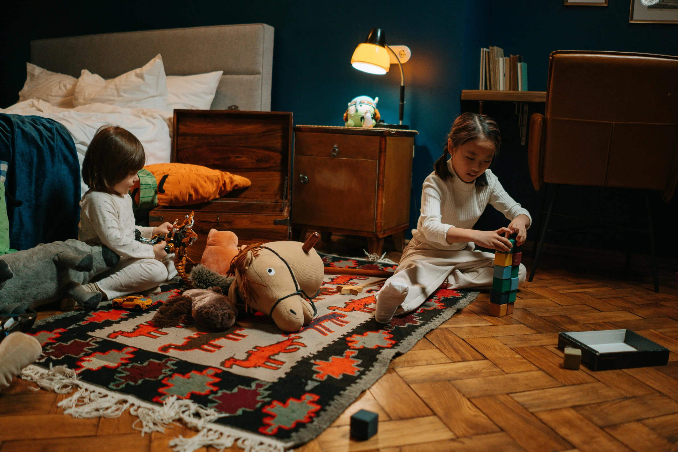 two little girls sitting on the floor playing with toys, by Julia Pishtar, pexels contest winner, arts and crafts movement, ghostly teenager bedroom, an escape room in a small, a handsome, rugs