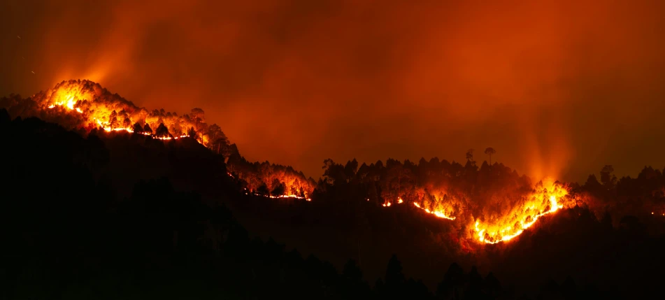 a fire burning on the side of a mountain, by Jorge Velarde, hurufiyya, where a large, app, iu, former