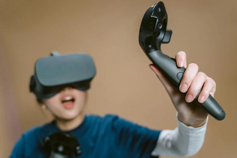 a man in a blue shirt holding a video game controller, interactive art, floating vr headsets, avatar image, vhsrip, trending photo