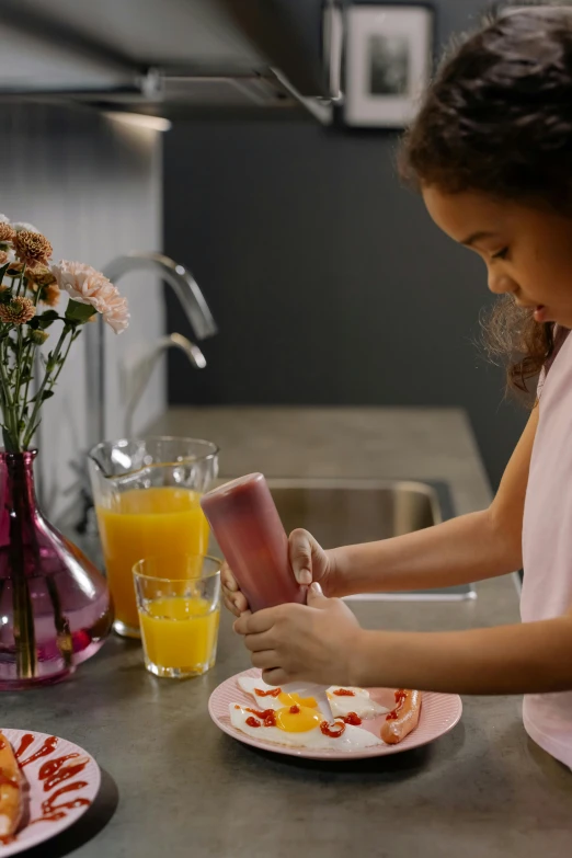 a little girl is preparing breakfast in the kitchen, featured on pinterest, smooth surface, onyx, pink, amber