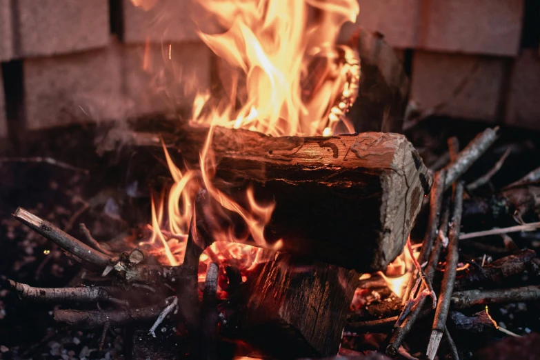 a fire in the middle of a pile of wood, pexels contest winner, renaissance, warm fireplace, profile image, thumbnail