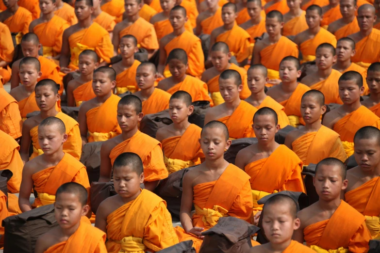 a large group of monks sitting next to each other, by Robert Peak, pexels, avatar image, getty images, thawan duchanee, 15081959 21121991 01012000 4k