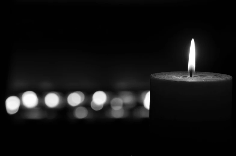 a black and white photo of a lit candle, a black and white photo, by Caroline Mytinger, pexels, where being rest in peace, profile picture 1024px, bright lights, set photo