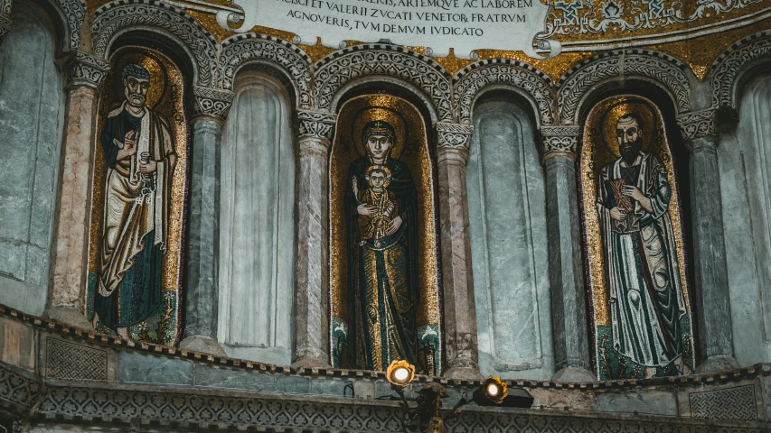 a group of statues on the side of a building, a mosaic, by Cimabue, unsplash contest winner, romanesque, in this church interior, jayson tatum as mother mary, 🚿🗝📝, gold embroidery