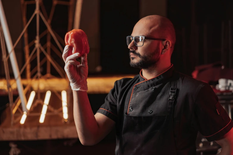 a man holding a piece of meat in his hand, a portrait, by Adam Marczyński, pexels contest winner, soap carving, chef platypus, holding a ball, behind the scenes photo