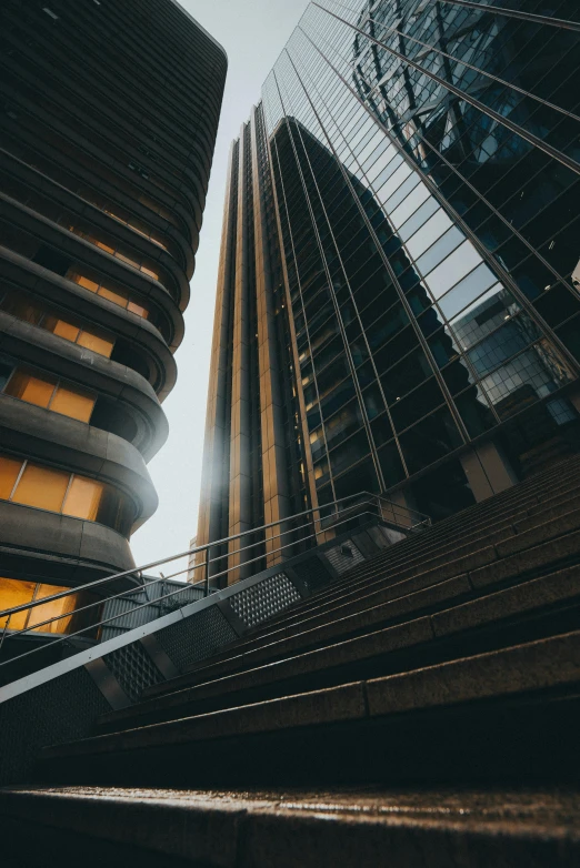 a couple of tall buildings next to each other, unsplash contest winner, flowing lines, inside a grand, up close, portrait photo