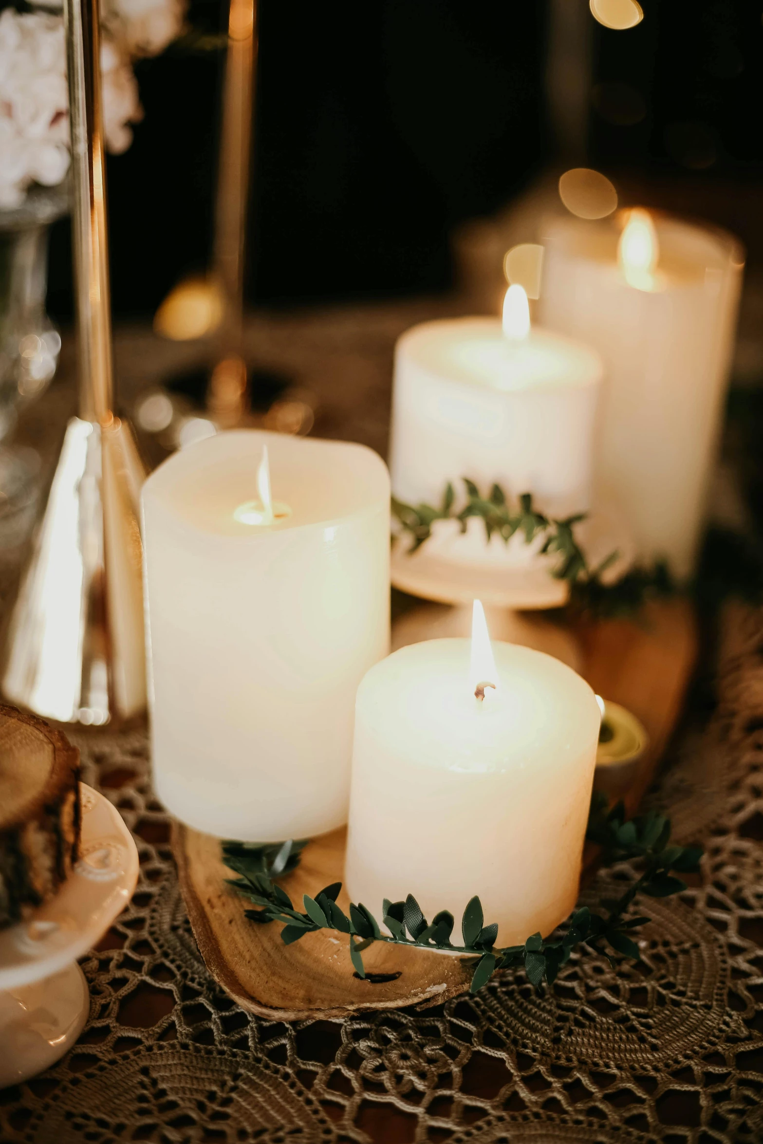 a bunch of candles sitting on top of a table, soft white glow, multiple details, glowing accents, worn