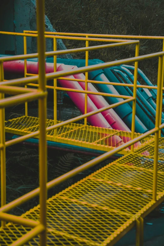 a bunch of pipes that are next to each other, a picture, inspired by Elsa Bleda, pexels contest winner, modular constructivism, pink and yellow, water park, ladders, promo image