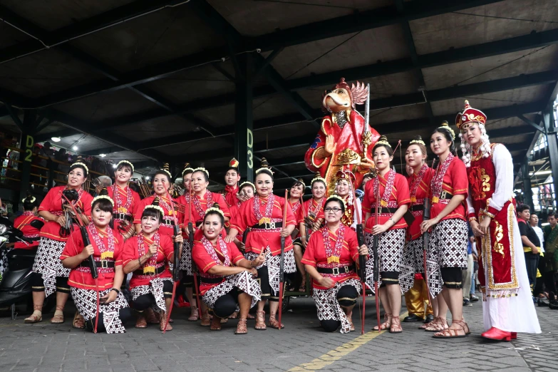 a group of people standing next to each other, inspired by I Ketut Soki, pexels contest winner, hurufiyya, reds), square, deity)