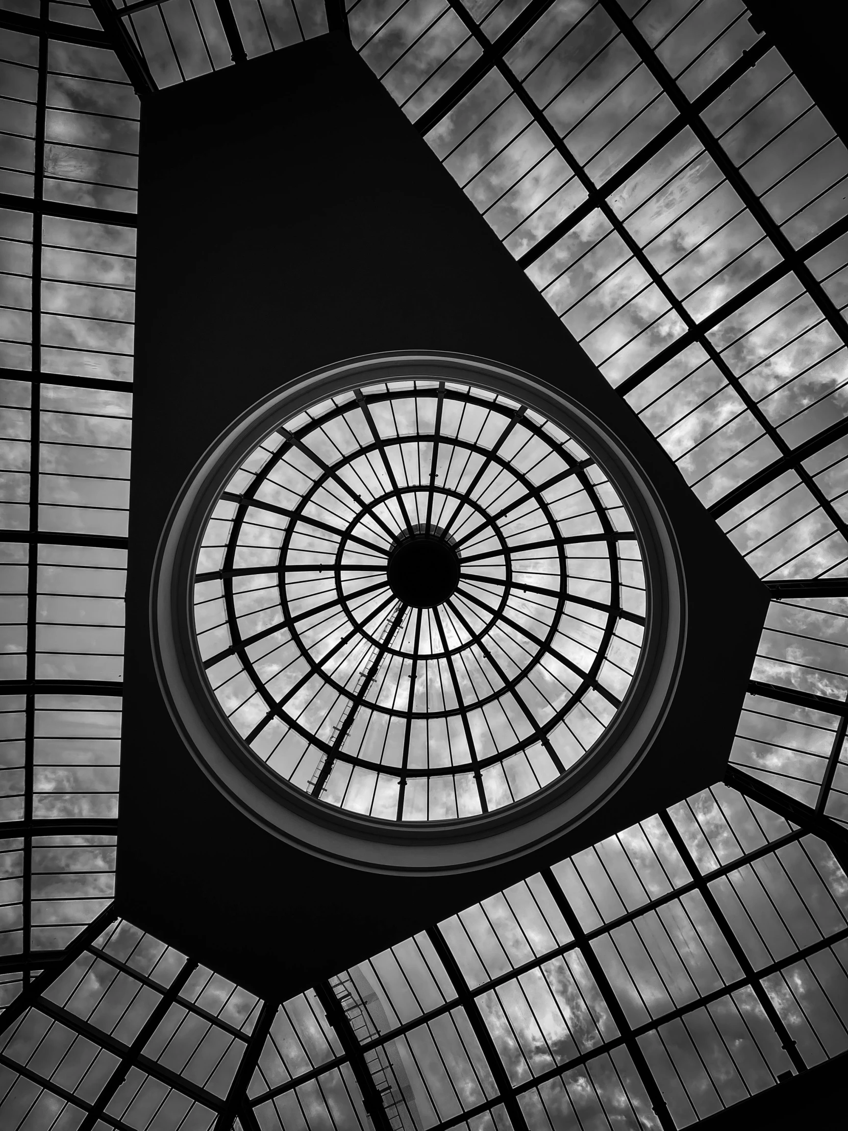 a black and white photo of a glass ceiling, by Patrick Pietropoli, large round window, 82 mm sigma art -, art deco!!, maxim verehin stained glass