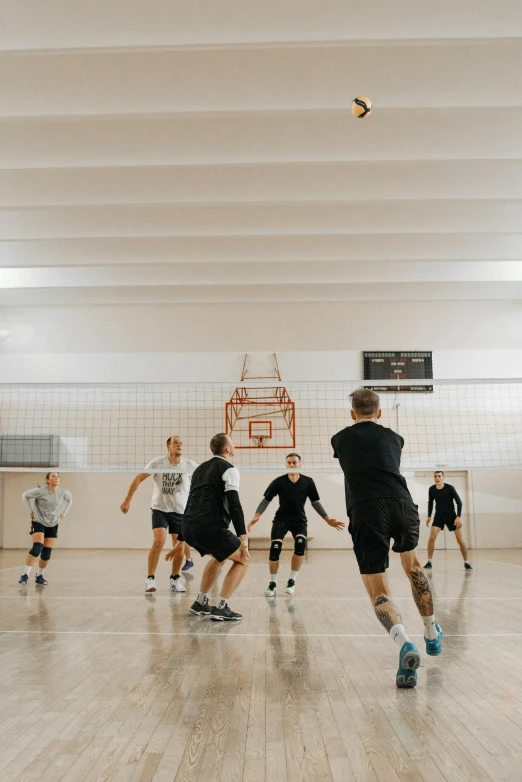 a group of young men playing a game of volleyball, by Sebastian Spreng, unsplash contest winner, modernism, in a gym, 4k), sweden, medium height