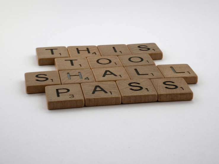 scrabble tiles spelling this too shall pass, inspired by Ian Hamilton Finlay, press photograph, educational, 2 0 2 4, a wooden