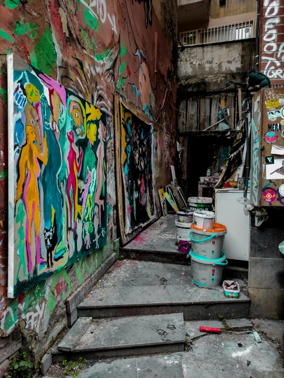 a narrow alley with graffiti on the walls, graffiti art, inspired by Elsa Bleda, pexels contest winner, inside a grand messy studio, panoramic, promo image, color image