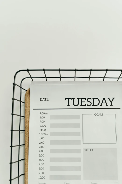 a calendar sitting on top of a table next to a cup of coffee, by Robbie Trevino, trending on unsplash, black on white background, half textured half wireframe, good day, shelf