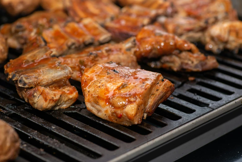 a close up of a grill with meat on it, profile image, thumbnail, product shot, caramel