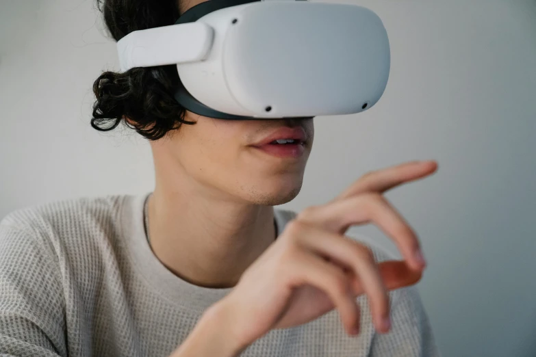 a man wearing a virtual reality headset, a computer rendering, trending on pexels, hypermodernism, with index finger, teenage boy, ariel perez, close up portrait shot
