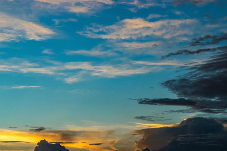 there is a plane that is flying in the sky, by Alexander Runciman, unsplash, fan favorite, colorful skies, panorama, late afternoon