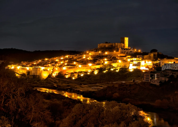 a view of a town lit up at night, pexels contest winner, renaissance, arrendajo in avila pinewood, ibiza, panoramic, profile image