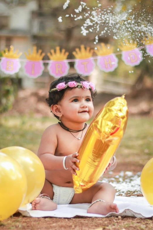 a baby girl playing with a bunch of balloons, a picture, shutterstock contest winner, samikshavad, with a gold crown, 🐿🍸🍋