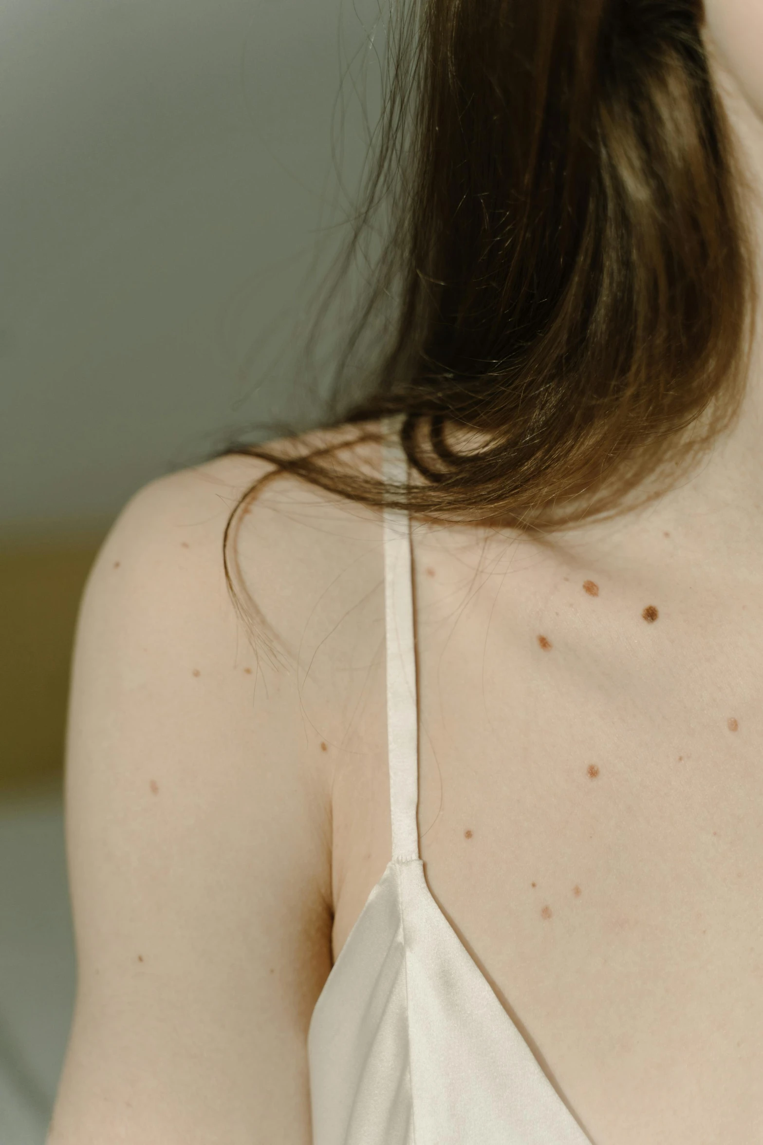 a woman in a white dress brushing her teeth, an album cover, inspired by Elsa Bleda, reddit, freckles on chicks, ignant, cracked body full of scars, detail shots