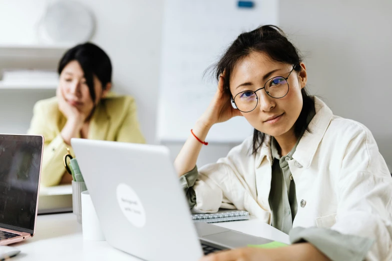 a woman sitting in front of a laptop computer, by Jang Seung-eop, trending on pexels, school class, medium shot of two characters, avatar image, super focused