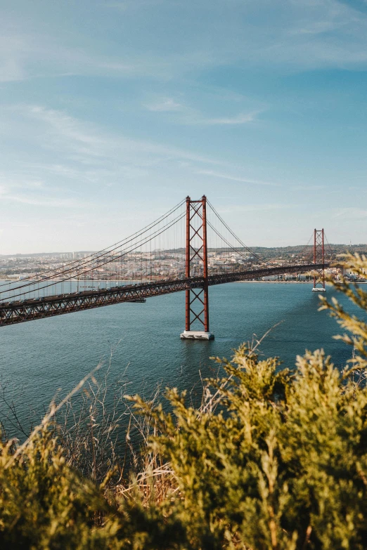 a view of a bridge over a body of water, pexels contest winner, happening, lisbon, ultrawide landscape, 🚿🗝📝