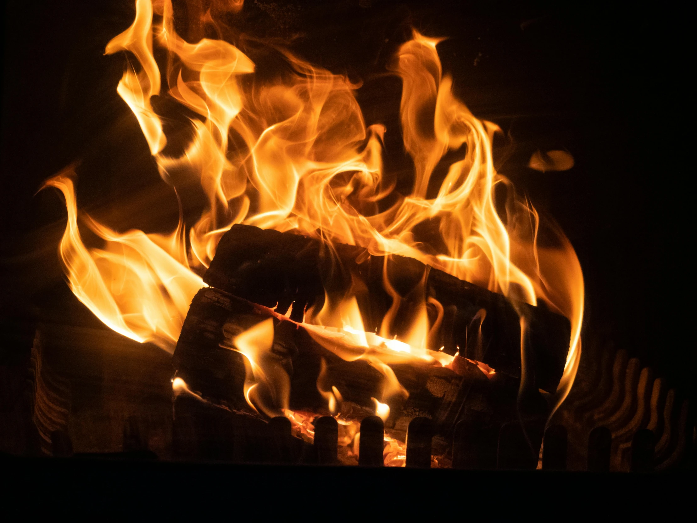 a close up of a fire in a fireplace, pexels contest winner, profile image, thumbnail, 1 2 9 7, multiple stories