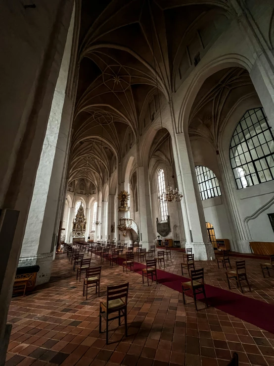 a church filled with lots of tables and chairs, by Jacob Toorenvliet, unsplash contest winner, baroque, white sweeping arches, gothic interior, high quality photo, panorama view