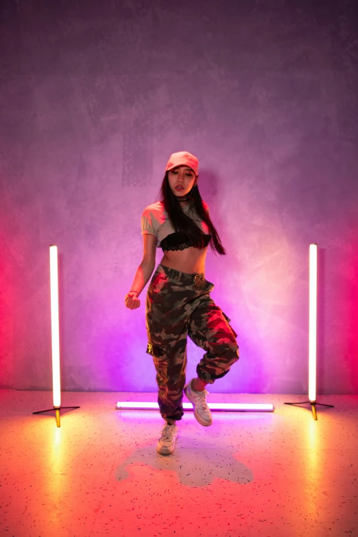 a woman that is standing in front of some lights, hip hop, alanis guillen, doing a sassy pose, militaristic