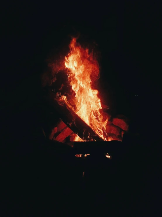a bonfire is lit up in the dark, profile image, shot onfilm, multiple stories, instagram picture