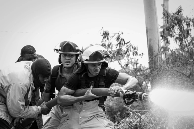 a black and white photo of a group of firefighters, pexels contest winner, happening, cuba, powering up, instagram post, promo image