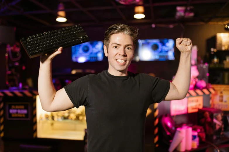 a man holding a keyboard up in the air, a portrait, featured on reddit, server in the middle, bowling, lachlan bailey, 15081959 21121991 01012000 4k