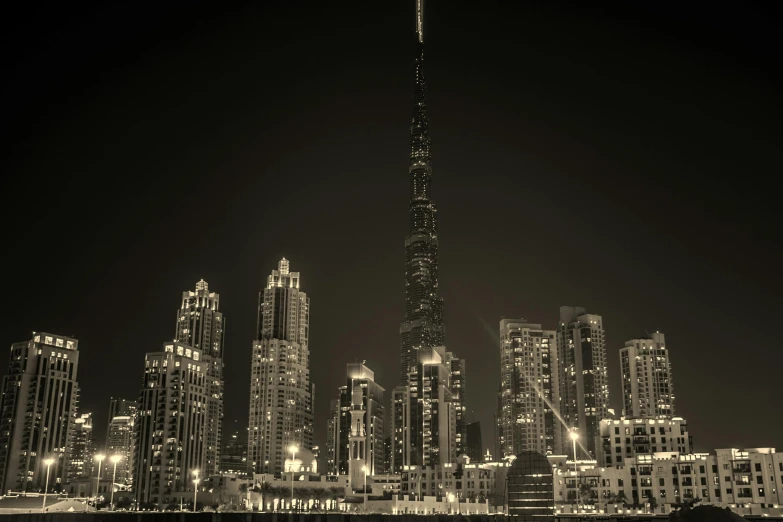 a black and white photo of a city at night, a black and white photo, pexels contest winner, art photography, gta : dubai, tall spires, fine art print, mixed art