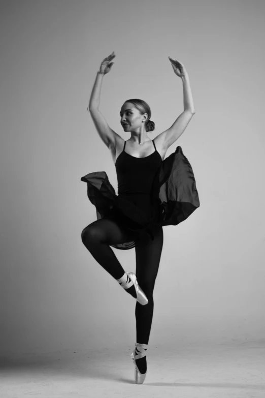 a woman in a black leo leo leo leo leo leo leo leo leo leo leo leo leo, inspired by Elizabeth Polunin, in black and white, dressed as a ballerina, alexis franklin, pose(arms up + happy)