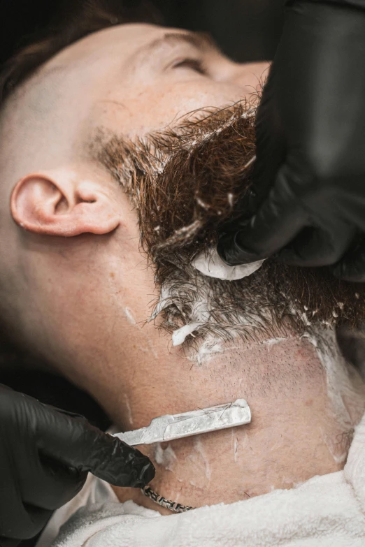 a man getting a shave in a barber shop, an album cover, trending on pexels, rotting clay skin, thumbnail, a pale skin, brown