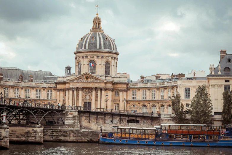 a boat that is sitting in the water, pexels contest winner, paris school, neoclassical tower with dome, brown, petite, exterior