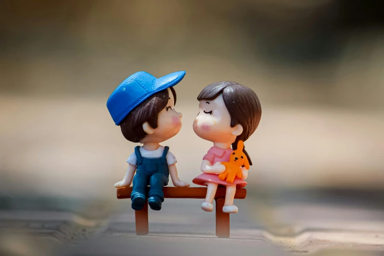 a couple of figurines sitting on top of a wooden bench, pexels contest winner, lips, cute boy, plastic toy, girls