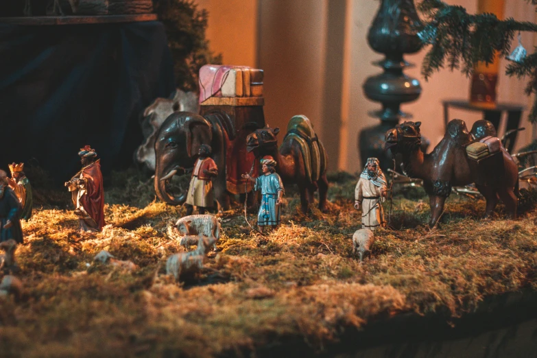 a group of figurines sitting on top of a table, by Daniel Lieske, pexels contest winner, decorated ornaments, middle eastern, farming, beautifully soft lit