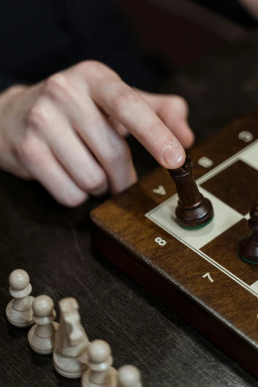 a close up of a person playing a game of chess, brown and cream color scheme, thumbnail, hammershøi, augments