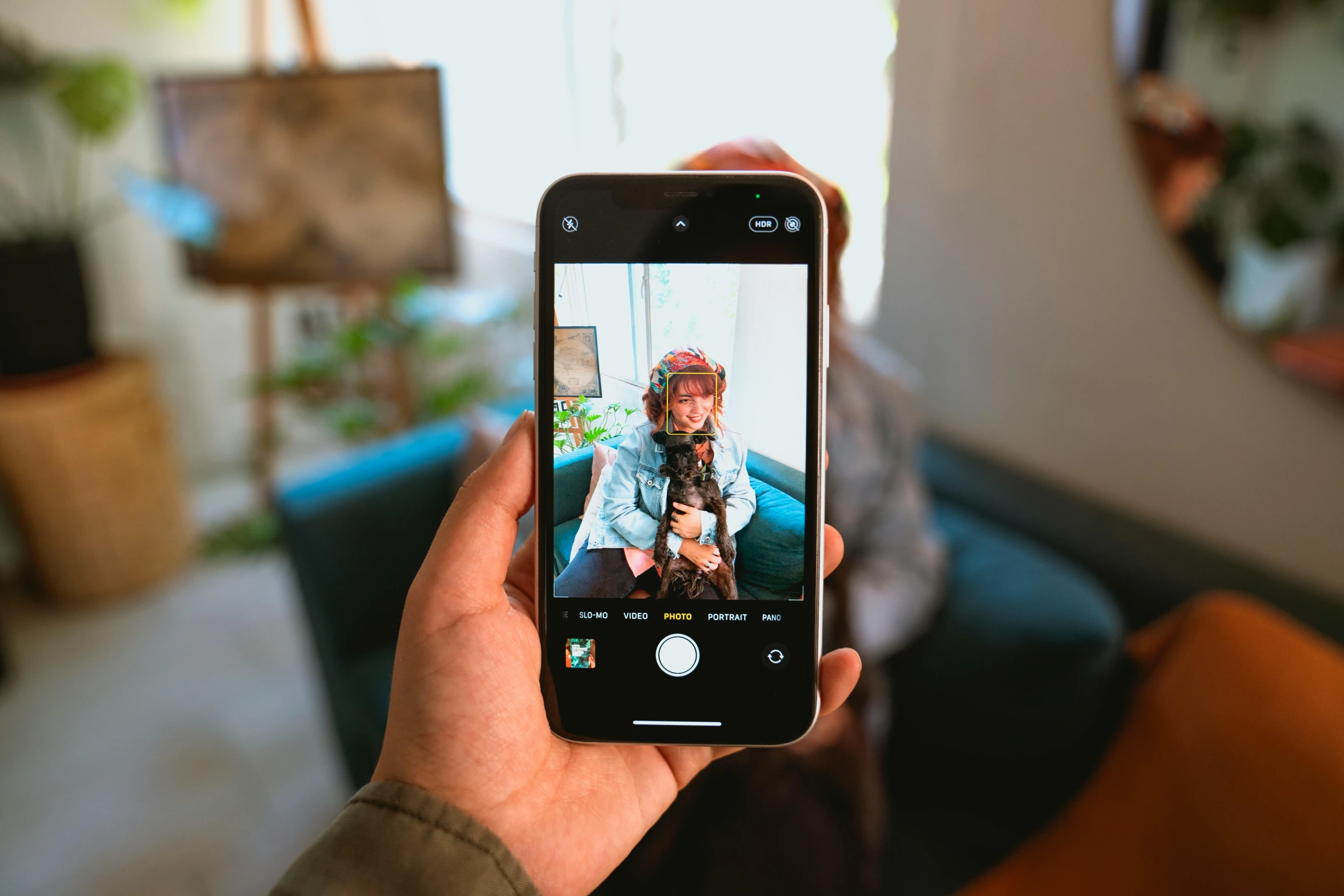 a person taking a picture with their cell phone, by Julia Pishtar, pexels contest winner, photorealism, medium shot of two characters, home photography portrait, full color photograph, portrait of an ai