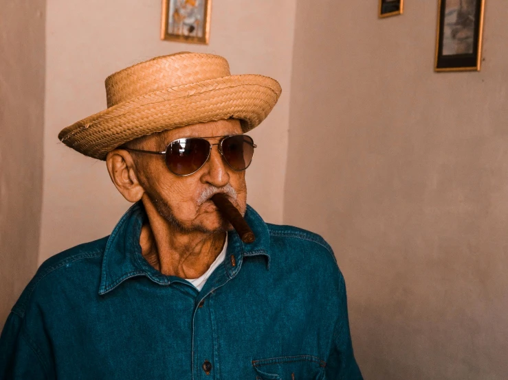 a man wearing a straw hat and sunglasses smoking a cigar, inspired by Humberto Castro, pexels contest winner, nursing home, wearing a light blue shirt, thumbnail, hispanic