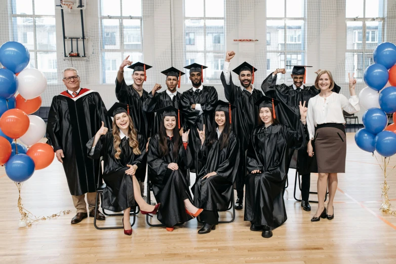 a group of people in graduation gowns posing for a picture, a portrait, unsplash, academic art, canada, 🦩🪐🐞👩🏻🦳, leather robes, portrait n - 9