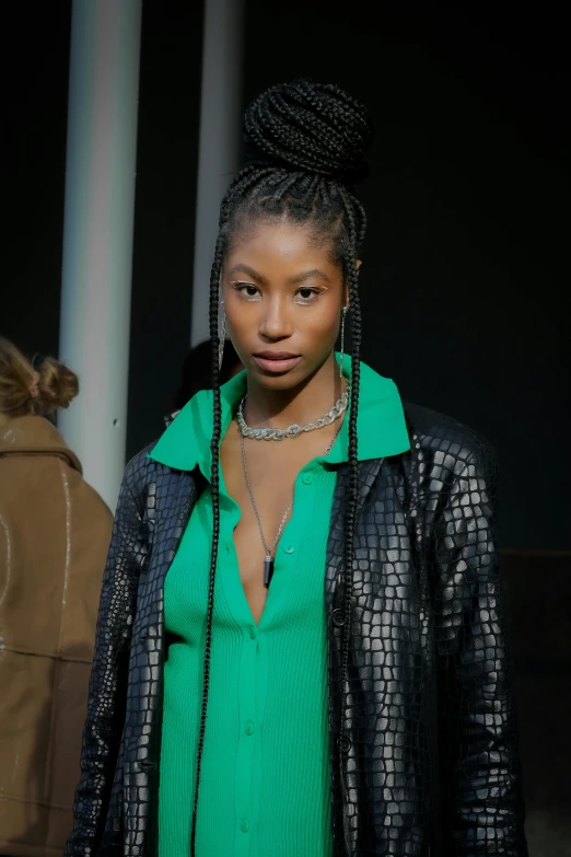 a woman in a green shirt and black jacket, trending on pexels, renaissance, at new york fashion week, box braids, zendaya, promo image