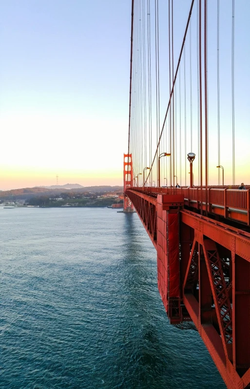 a view of the golden gate bridge at sunset, happening, epic view, up-close, looking off to the side, photo 4k