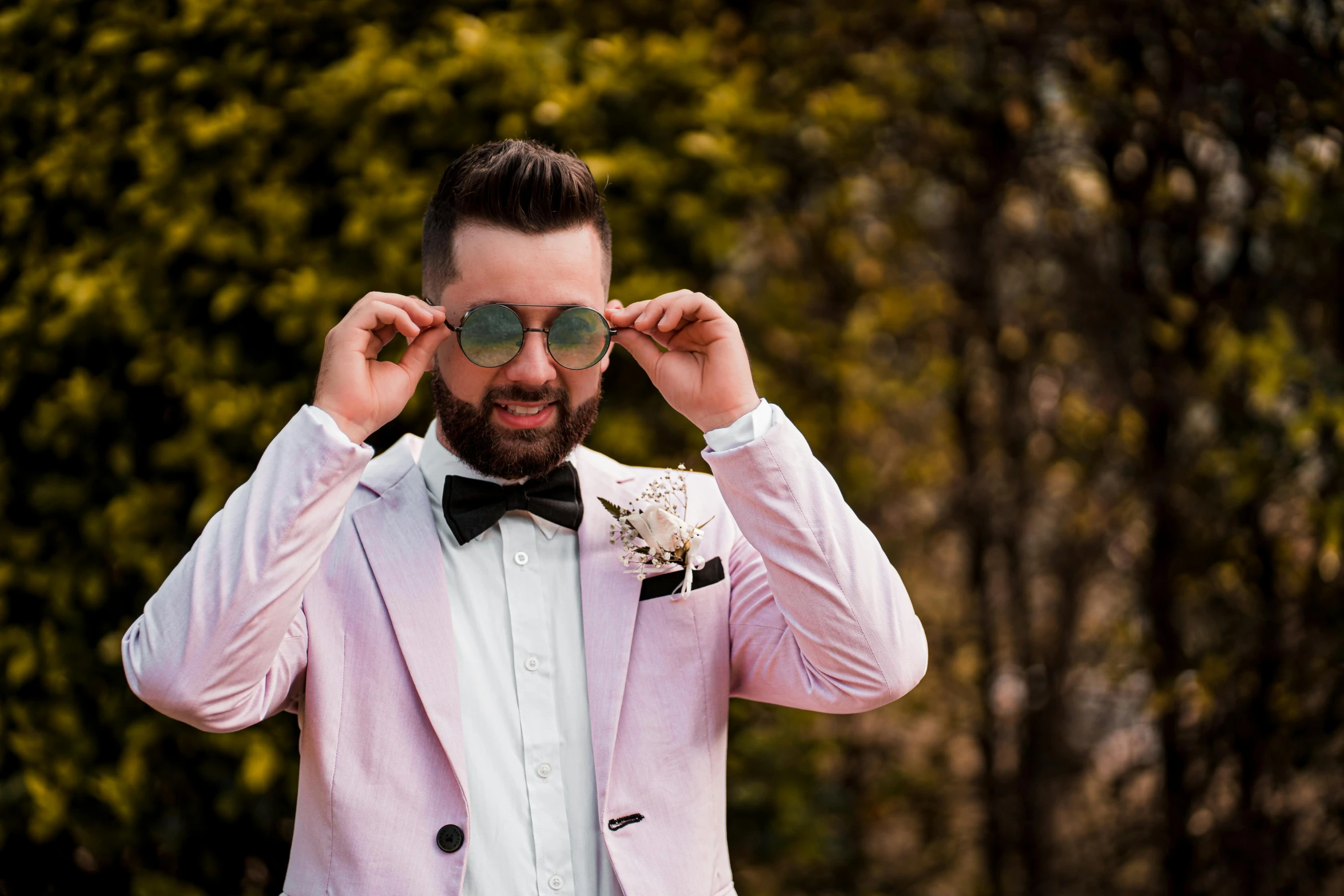 a man wearing a pink suit and bow tie, inspired by Zoran Mušič, pexels contest winner, neo-romanticism, garden behind the glasses, avatar image, wedding photo, wearing a white tuxedo