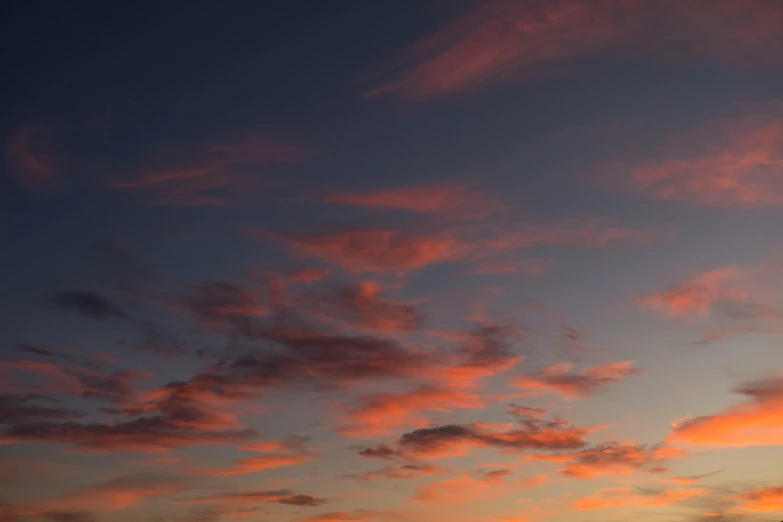 a couple of kites that are flying in the sky, by Ian Fairweather, unsplash, romanticism, sunset panorama, layered stratocumulus clouds, pink, goodnight