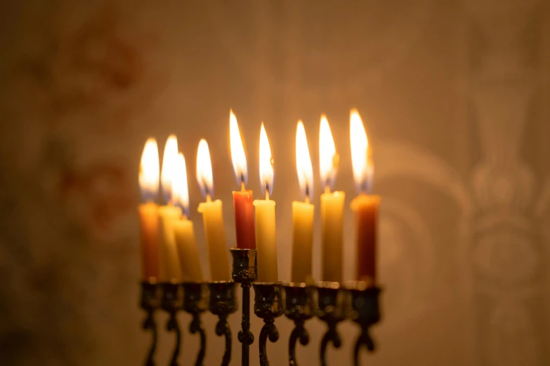 a group of lit candles sitting on top of a table, hebrew, fan favorite, shot with canon eoa 6 d mark ii, soft lighting |