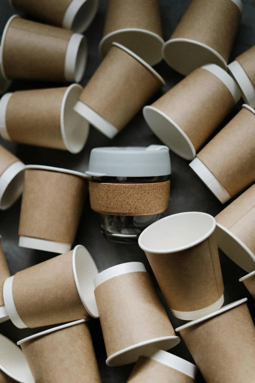 a pile of coffee cups sitting on top of a table, sustainable materials, detailed product image, thumbnail, 1 0