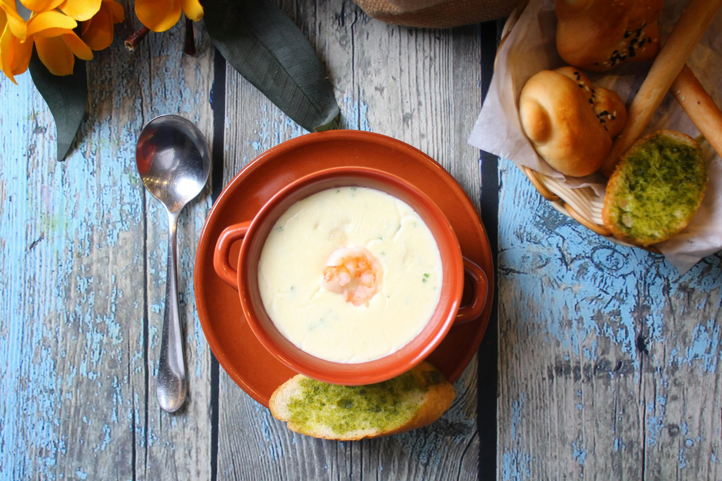 a bowl of soup sitting on top of a wooden table, cream, hasbulla, offering a plate of food, avatar image