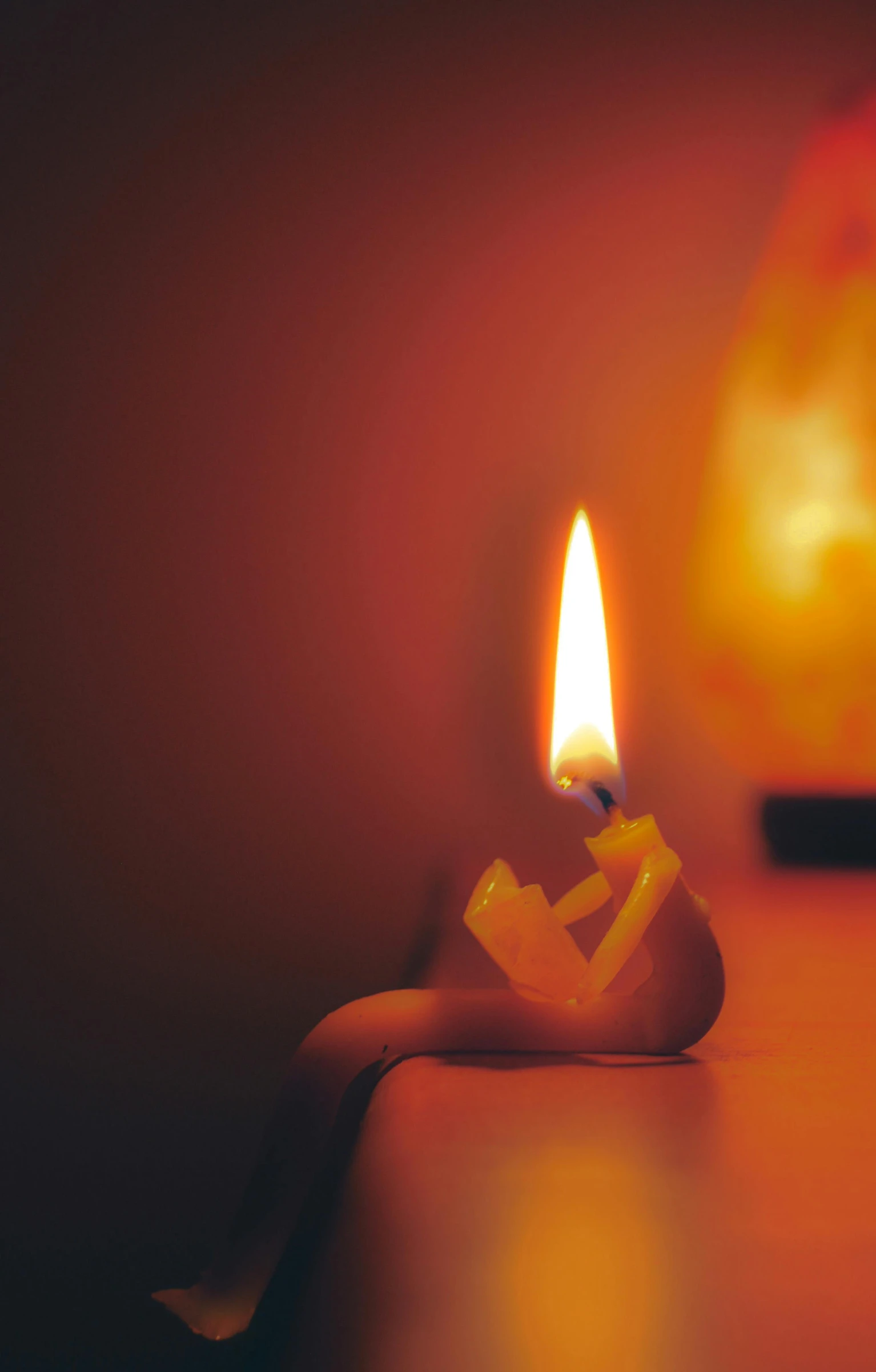 a lit candle sitting on top of a table, pexels, digital art, broken, orange lamp, archive photo, enhanced